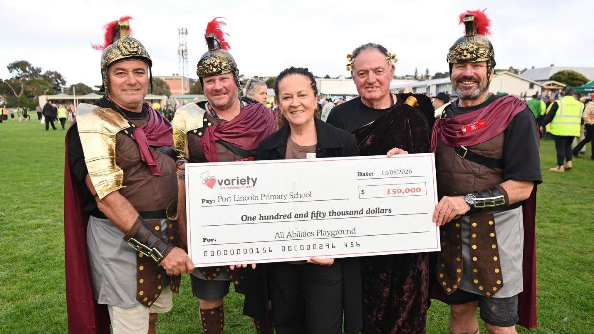 Four SA Variety Bash participants present a $150,000 cheque to Port Lincoln Primary School for a new all-abilities playground.